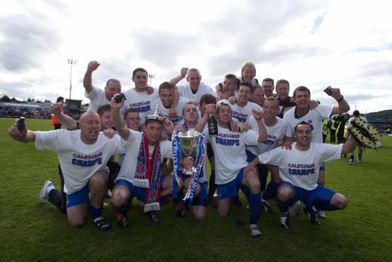 The Inverness Caley Thistle players celebrate being crowned Bell's First Division champions in 2004.