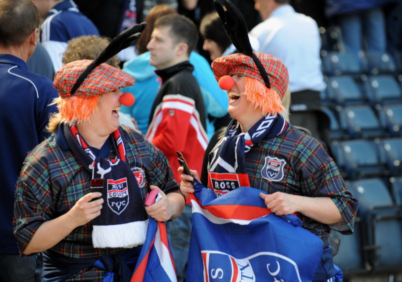 Ross County fans celebrate after seeing their team beat Celtic 2-0 in their Scottish Cup semi-final match at Hampden.