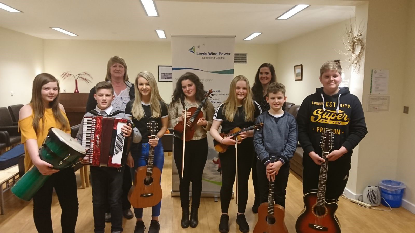 HebCelt director Caroline Maclennan (back, left) and Kerry Macphee with some young feis musicians.