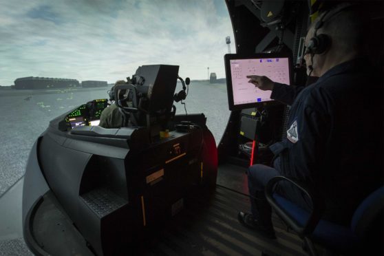 Robbie Low prepares a simulator at RAF
Lossiemouth for a training sortie.