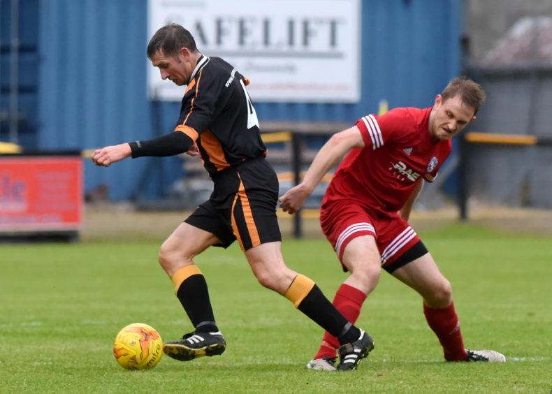 Wyness (left) playing for Huntly against Brora Rangers.
Picture by Kenny Elrick