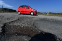 Potholes on the Netherley to Portlethen road near Lairhillock school