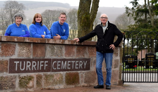 Friends of Turriff Cemetery have reached another milestone with the completion of a new wall at the entrance of the north east graveyard.    
Pictured - L-R Friends of Turriff Cemetery members Annette Stephen, Morag Lightning, Fraser Watson with the builder Brian McAllister.
