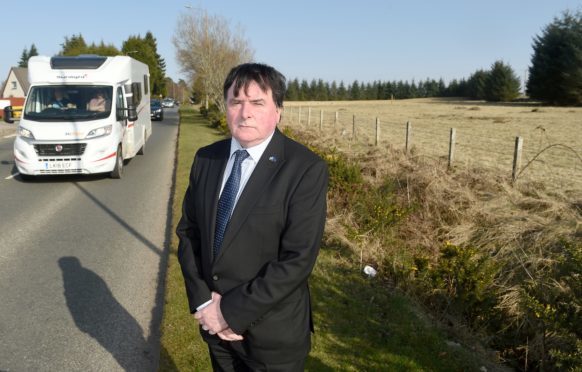 Inverness Councillor Ken Gowans at the site of the contentious planning application