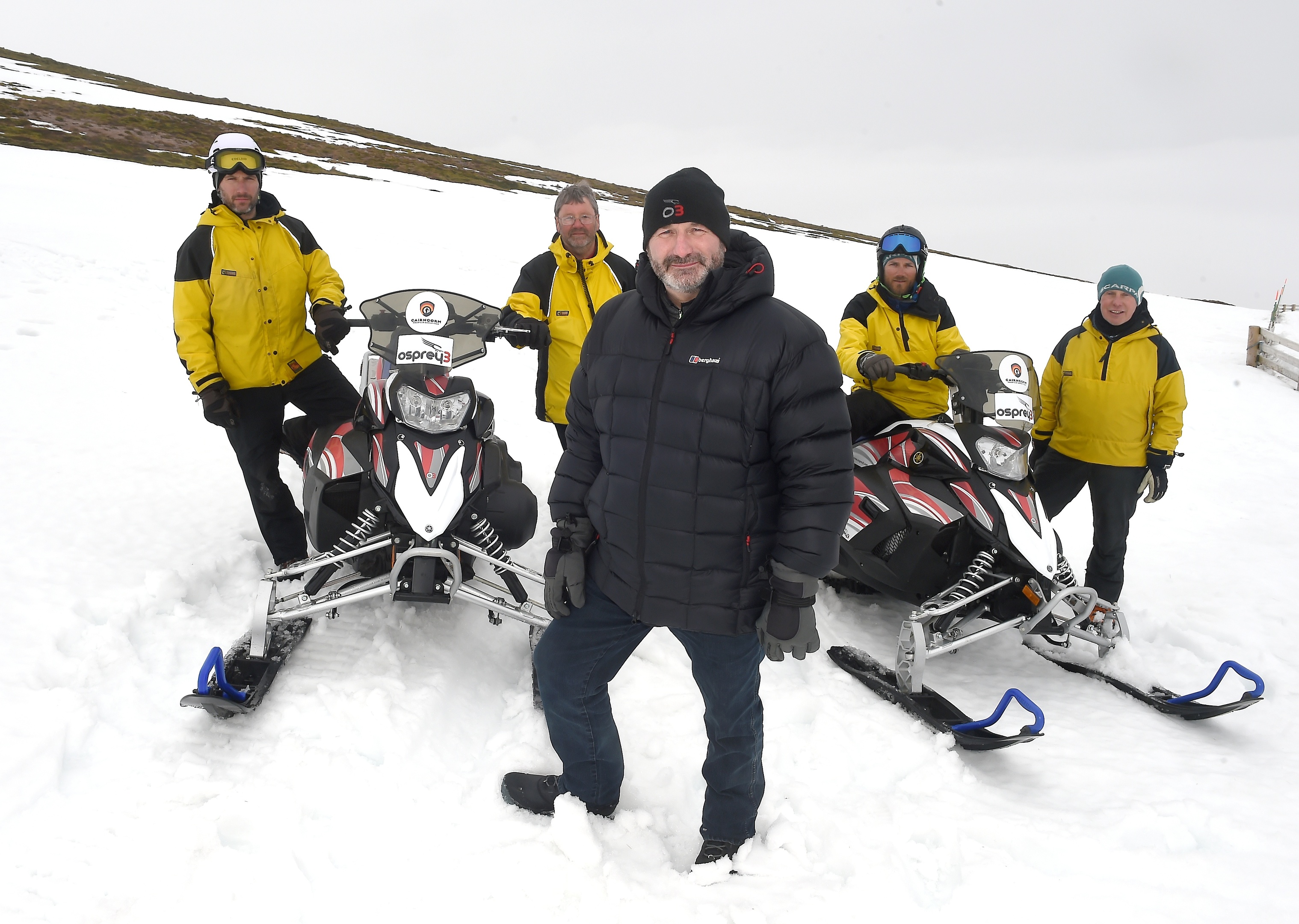 The Cairngorm Mountain Rescue Team  have been presented with two new snow scooters by Andy Clark and Laura Hepburn of Osprey3