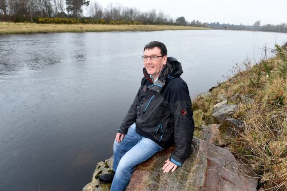 Bob Laughton, Director of the Findhorn Nairn & Lossie Fisheries Trust photographed beside the River Findhorn in Forres.