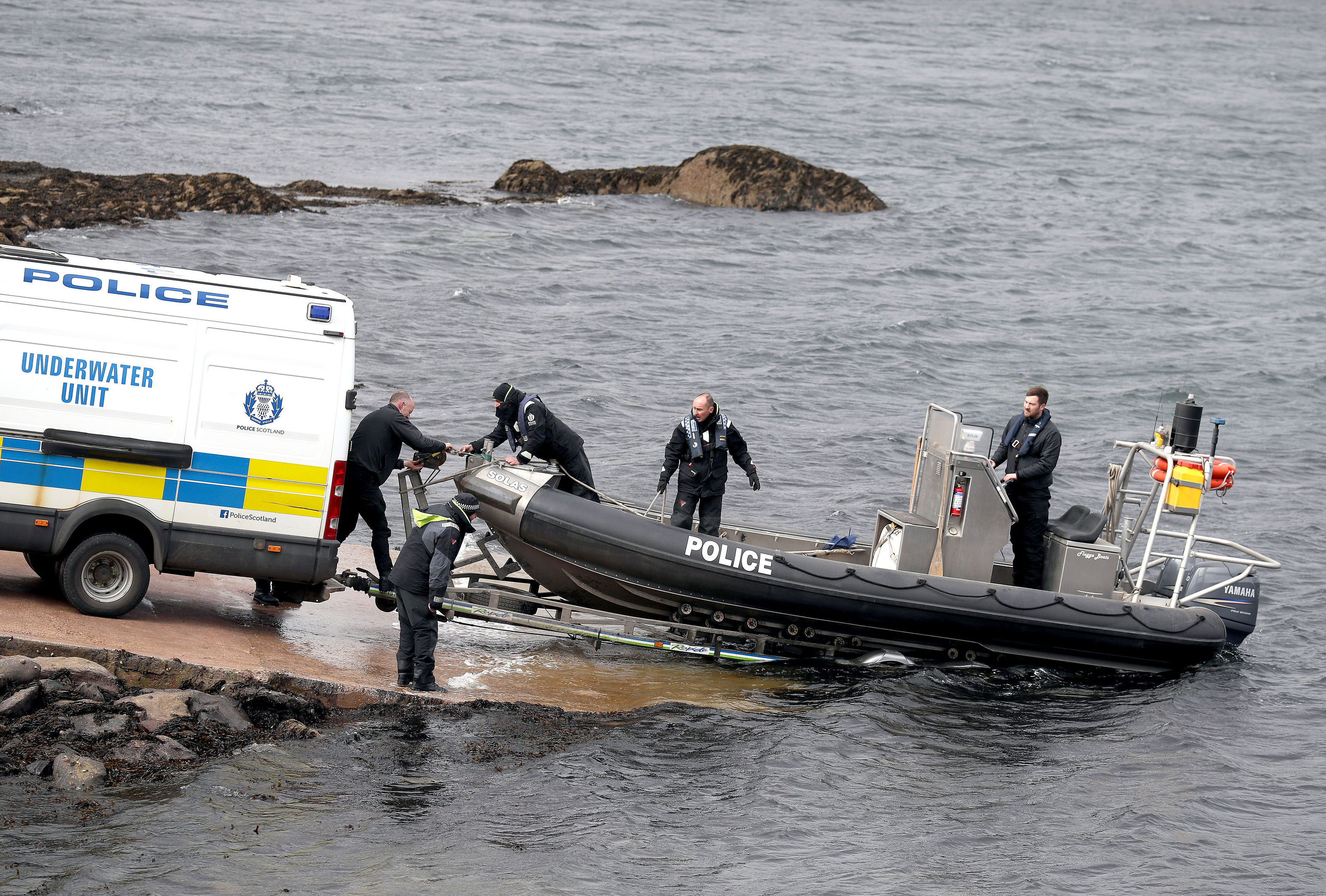 This underwater unit boat enters the water on Loch Fyne in Tarbert, Scotland, as Police Scotland continue their operation to recover the wreck of capsized fishing boat Nancy Glen after it sank on January 18 and resulted in the loss of fishermen Duncan MacDougall and Przemek Krawczyk. PRESS ASSOCIATION Photo. Picture date: Wednesday April 11, 2018. See PA story RESCUE Fisherman. Photo credit should read: Andrew Milligan/PA Wire