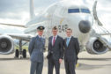 Defence Minister Gavin Williamson, pictured centre, and the new Posieidon P8 that will come into RAF service.
Also pictured: Station Commander Jim Walls, left, Moray MP Douglas Ross, right.