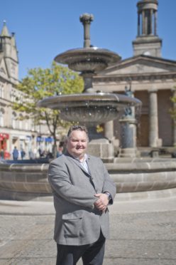 Councillor Graham Leadbitter at the fountain in Elgin.