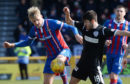 Inverness' Coll Donaldson and St Mirren's Ryan Flynn battle for possession.