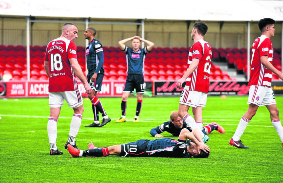 Dejection for Alex Schalk (10) as he misses a good chance to score