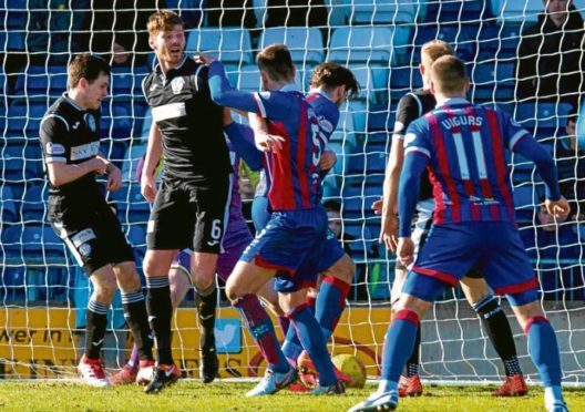 Inverness defender Gary Warren, third from right, prods the ball in to kick-start Caley Thistle’s recovery against St Mirren on Saturday