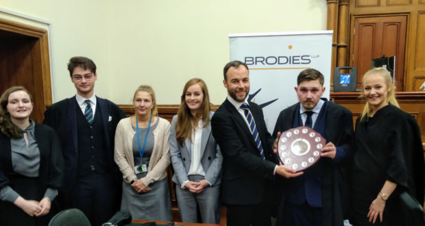 Left to right: Aberdeen Uni’s Naomi Henderson and Hal Ledgerwood, Brodies LLP’s Aimee Godfrey, Sarah Polson and Malcolm Mackay and RGU’s winning team Alex Rae and Justine Anderson.