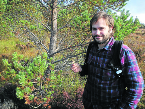 Jacob Whitson collecting mushrooms at Dundreggan.