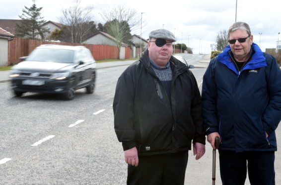 Residents worried about the speeders on Kinmundy Road, Peterhead. In the picture are Councillor Alan Buchan, left and resident, George Wilkinson.