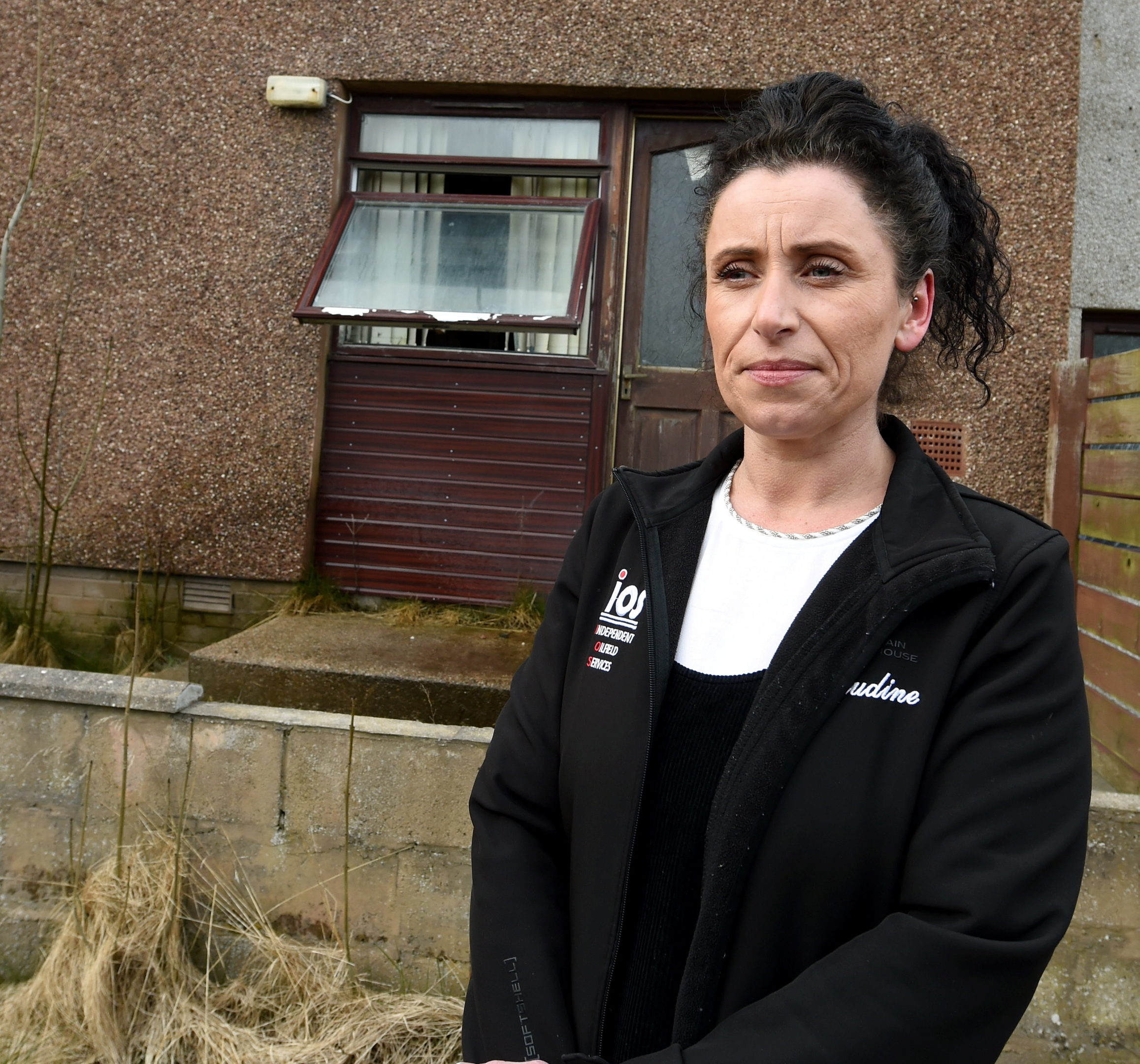Claudine Summers worried about the damp coming from next door  at Rose Avenue, Peterhead.