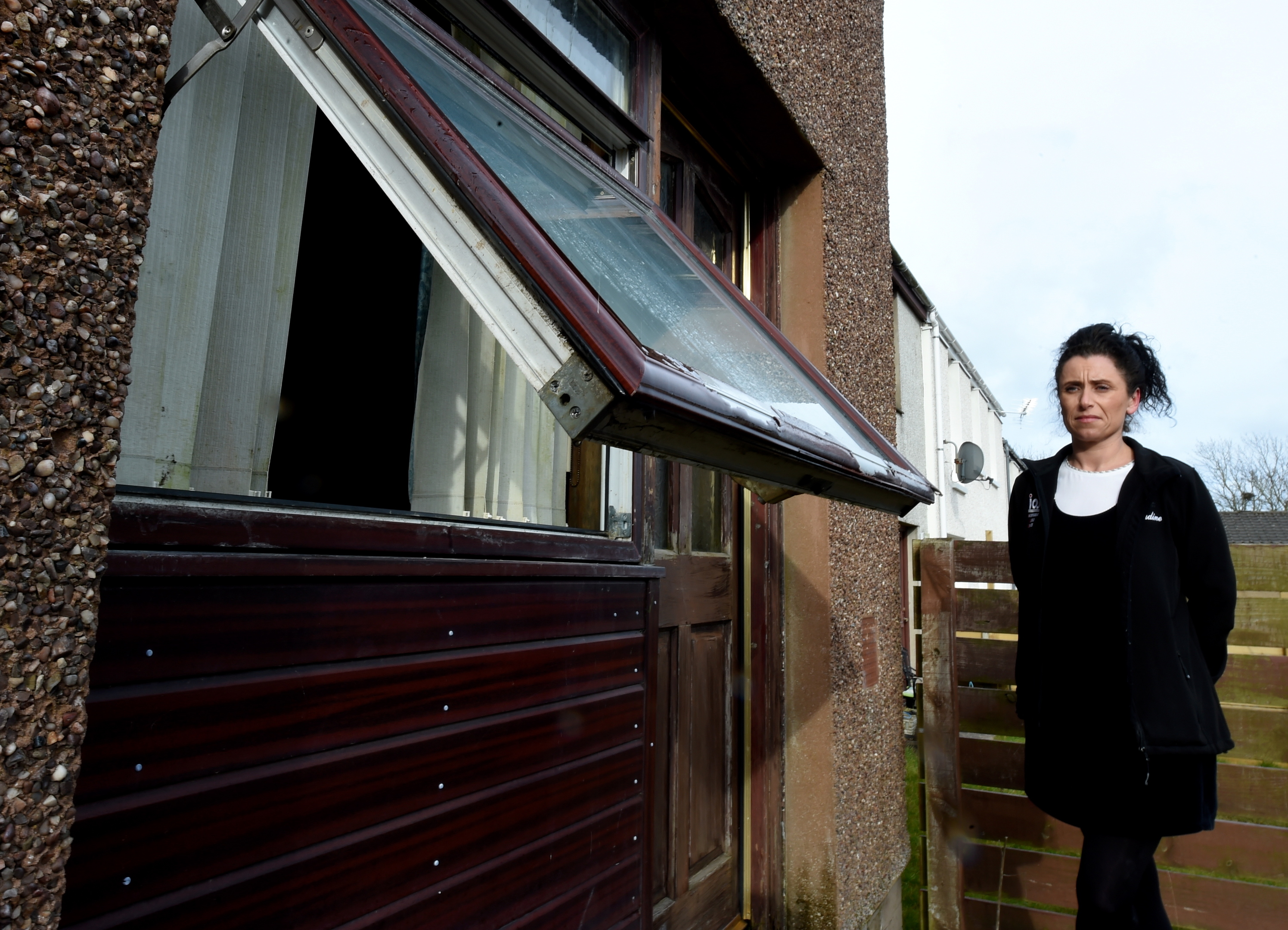 Claudine Summers is worried about the damp coming from next door  at Rose Avenue.