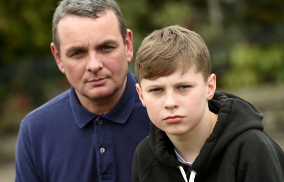 Drew Ramsay, 13, Alford, lost his drone when Maplin went into administration. In the picture are stepdad, Quentin Murray and Drew Ramsay.  
Picture by Jim Irvine  4-4-18