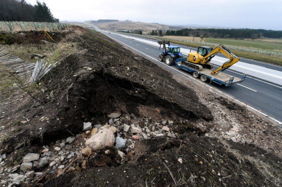 The area where the water builds up and the land erodes at the AWPR road near Kingswells