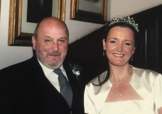 Zander Adam with Marina Donald, who he walked down the aisle on her wedding day.