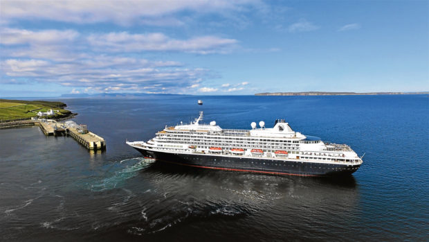 The 16,244 tonne Astoria manoeuvres her way around Scrabster harbour, heralding the start of the cruise ship season