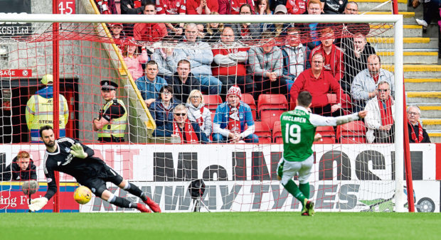 Aberdeen goalkeeper Joe Lewis saves Jamie MacLaren's first half penalty