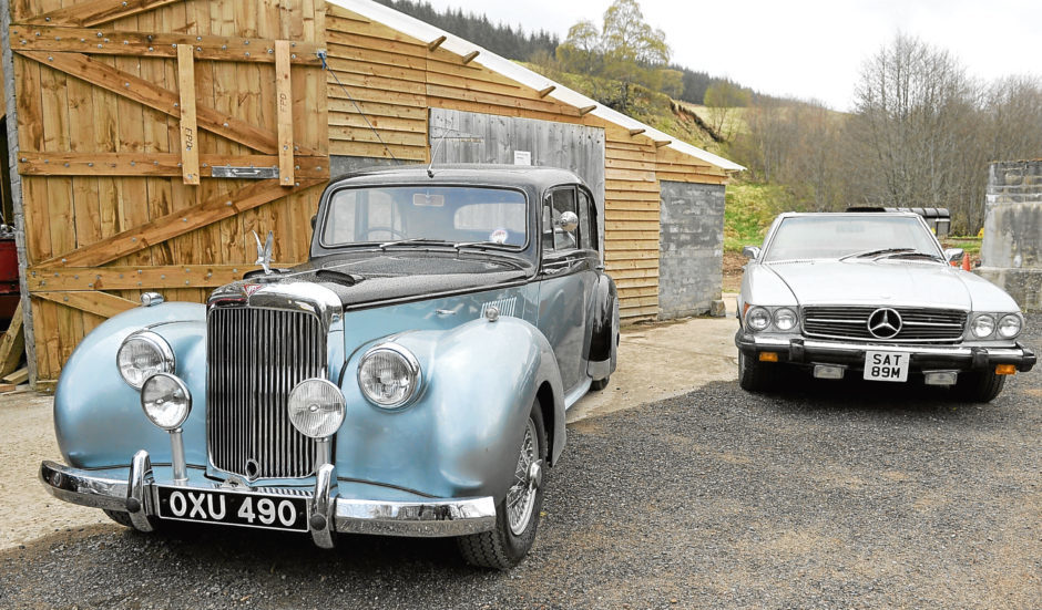 A snapshot of his Alvis and Mercedes.