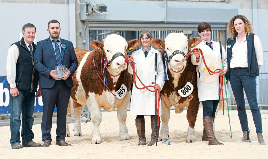 The Stronach family from Berryleys Farm, Grange, Keith, with their champion and reserve champion Simmental bulls