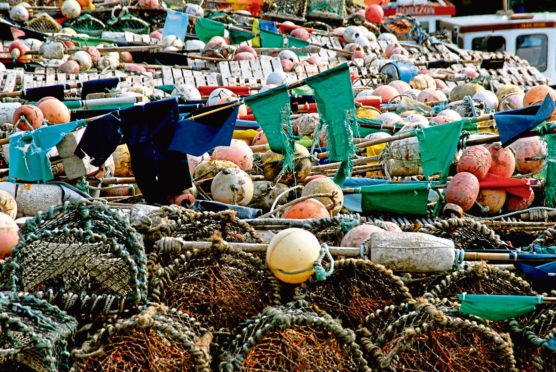 The Harbour at Arbroath seen with Creels, Floats and their Marker Flags all ready for the new season.