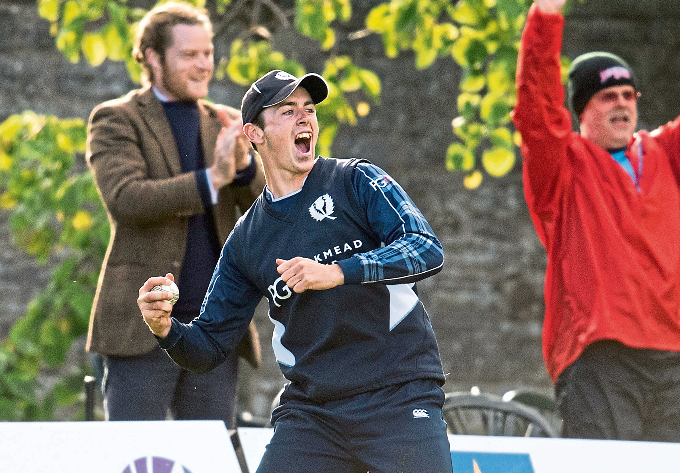 Scotland's Chris Sole catches the ball to put Zimbabwe's Malcolm Waller out.