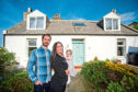 Holly Sandison, partner Steven Shaw and their daughter Violet outside Sea Holly Cottage, which                                       has undergone a transformation from top to bottom since they found it in a rundown condition