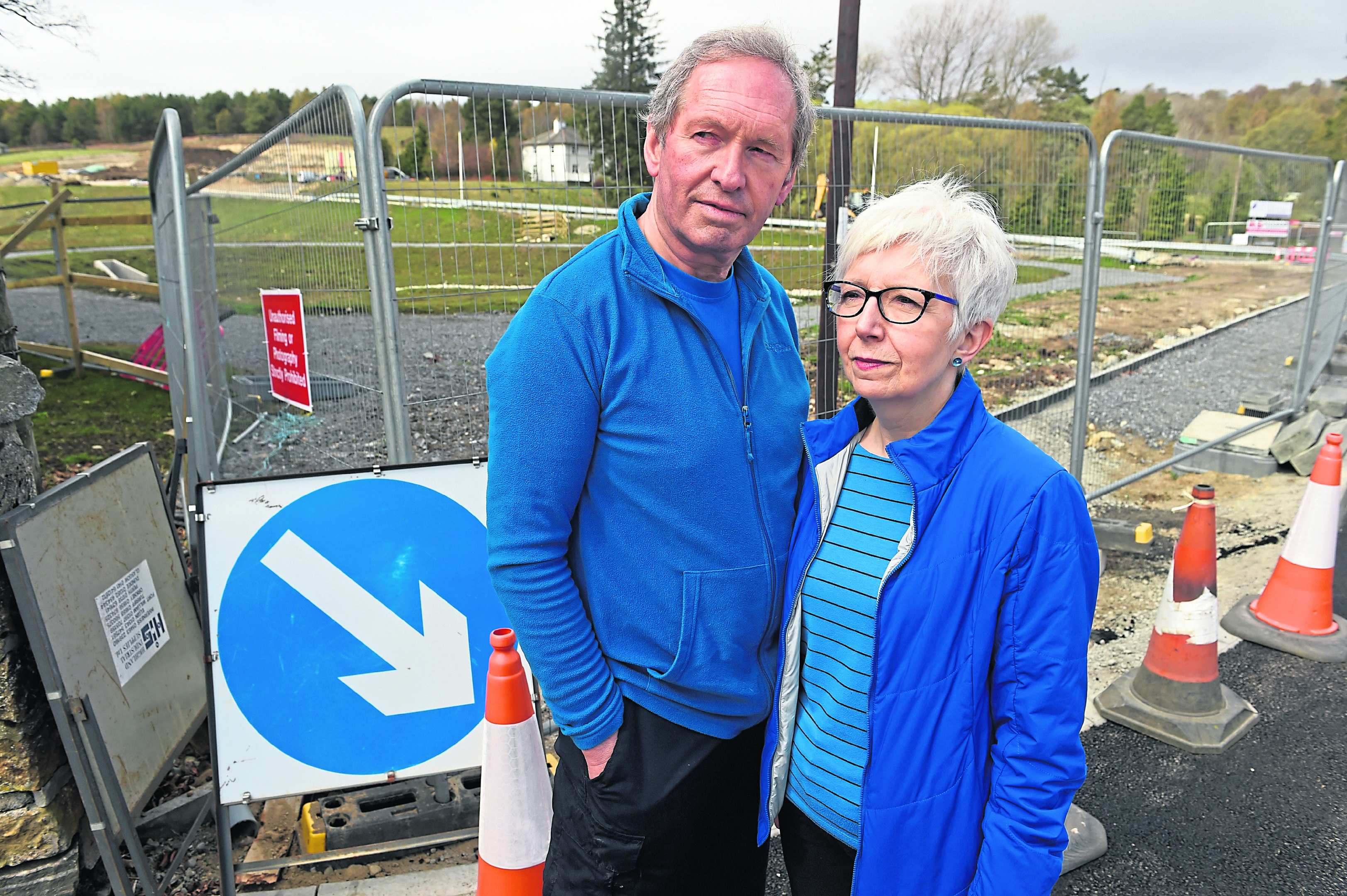 Gordon and Carol Bulloch of The Dulaig, Grantown with the controversial SUDS pond which is causing concern adjacent to their property.