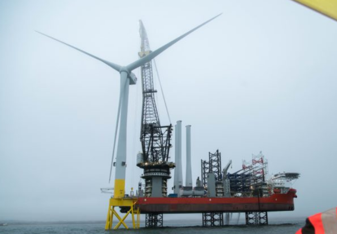 The installation of the first turbine on the European Offshore Wind Deployment Centre, off the coast of Aberdeen