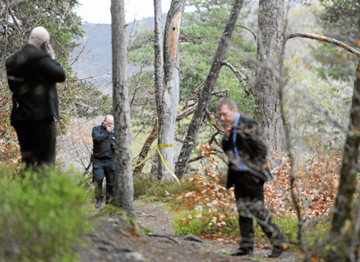 Police near the Invermoriston Falls after a woman died after falling into the river Moriston.