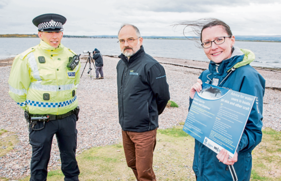 Pictured (L-R) are: PC Daniel Sutherland, Wildlife Crime Liaison Officer; Ben Leyshon of SNH and Alison Rose of Whale and Dolphin Centre at Speybay