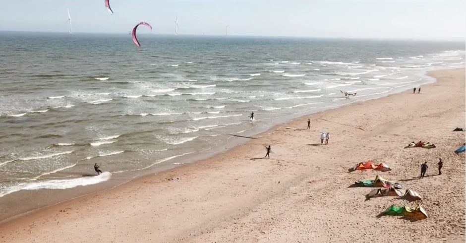 Kite surfers dance on the waves of Balmedie beach.