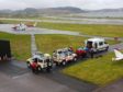 Oban Mountain Rescue and a Coastguard search and rescue Helicopter gathered at Oban Airport.