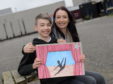 Dyce Academy pupil Josh McPherson's artwork is going to be showcased in the Scottish Parliament this June. He is pictured with his mum Catherine McPherson.
Picture by Kath Flannery.