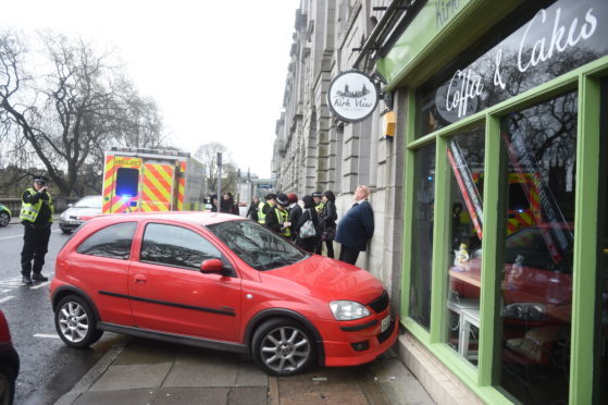 A red Vauxhall Corsa veered onto the footpath at Aberdeen’s Union Terrace.