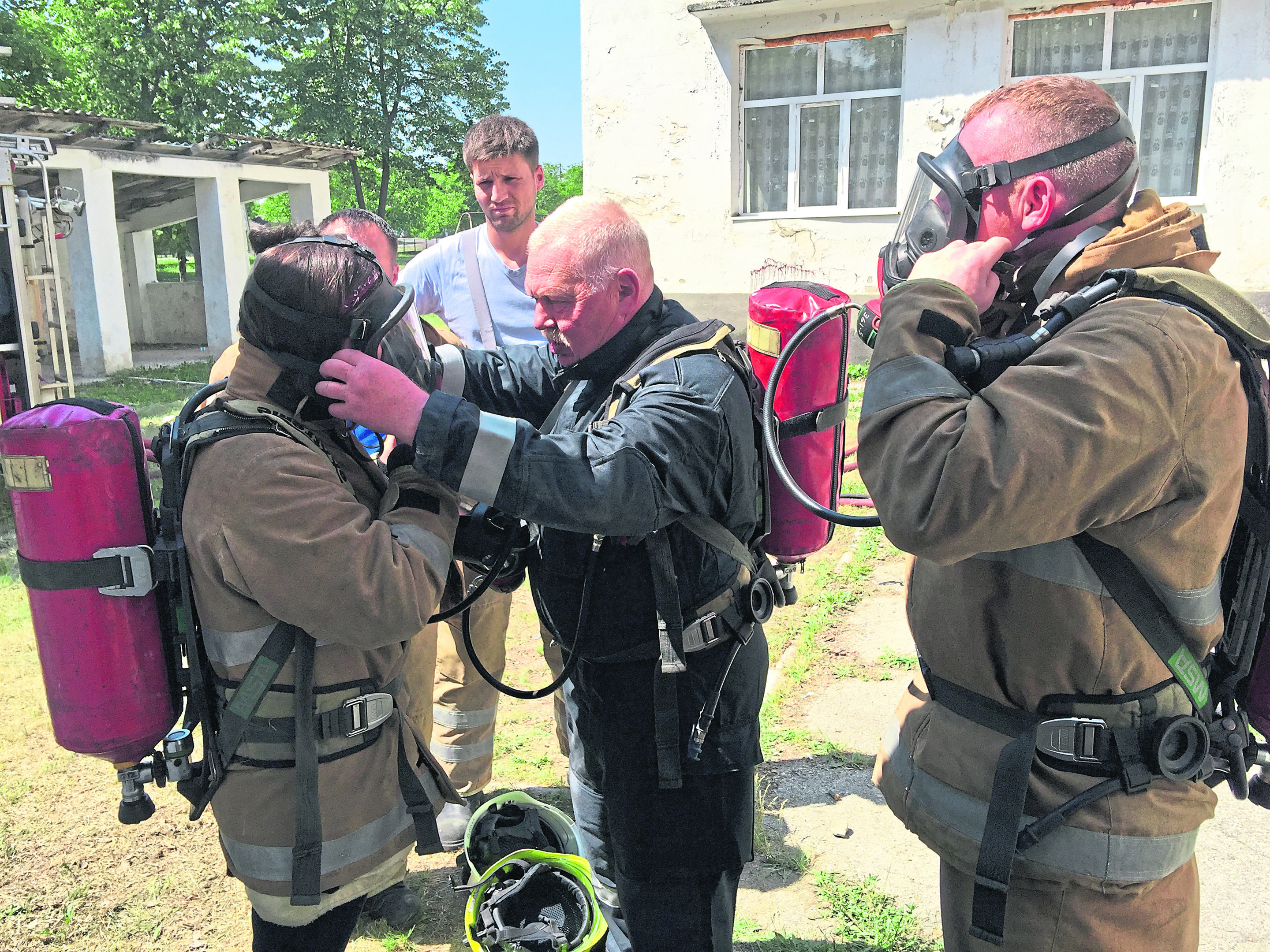 Volunteer Rab Forsyth demonstrates the use of breathing apparatus in Nisporeni, Moldova.