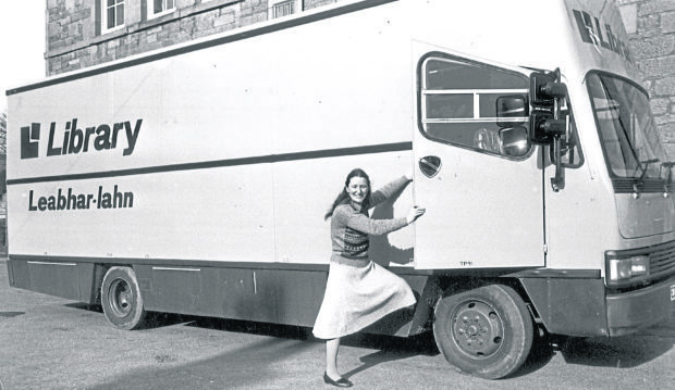 Mary Buchanan prepares to get into a mobile library, ready for another day spent calling at homes in the Black Isle in March 1988