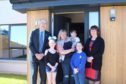 The Cruikshank family has moved into one of the new homes in Elgin. Pictured: council leader George Alexander, Tiegan Cruickshank, Lyndsey Cruickshank, Mikey Cruickshank, Katie Cruickshank, communities committee chairwoman Lorna Creswell.