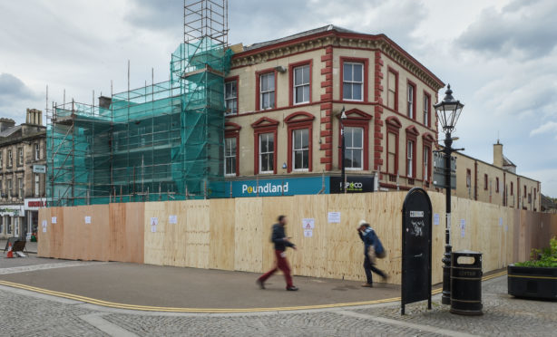 Poundland on High Street was sealed off, with a safety perimeter set up around the former 19th Century bank.