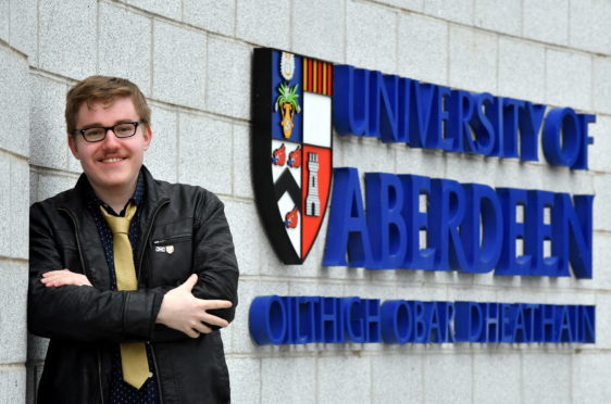 Frederic Bayer, President of the Celtic Society, at Aberdeen University, at the Regent Walk entrance to the university where the sign is by-lingual English and Gaelic.     
Picture by Kami Thomson.