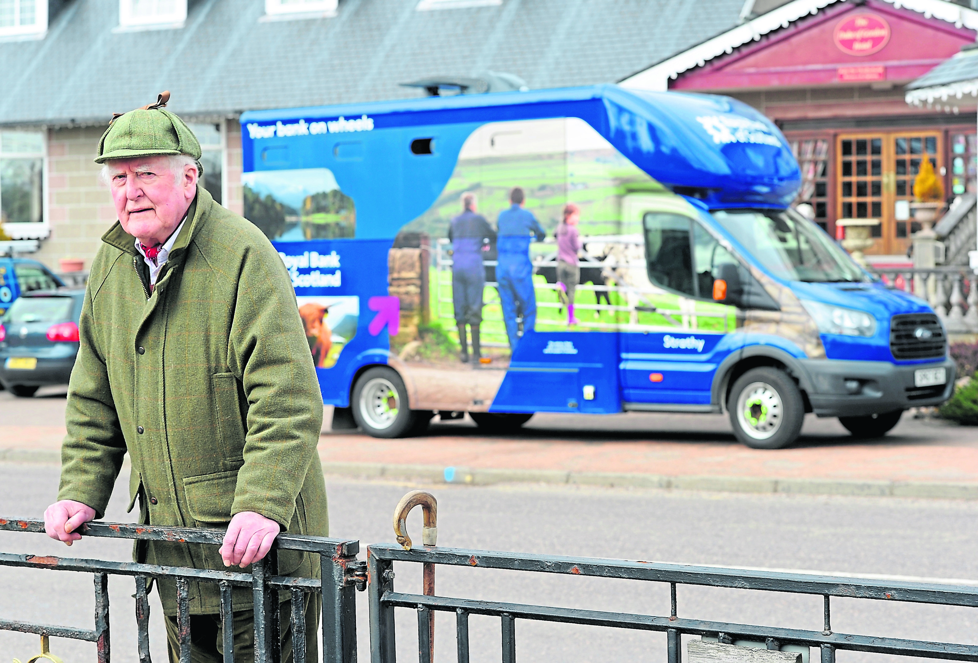 Joe Taylor, Kingussie Community Council Chairman outside the Royal Bank of Scotland van.