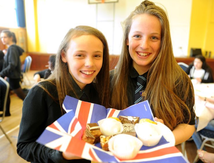 First year pupils Isla McArthur and Grace Bremner with some of the wedding fare on offer from Kilchumen School.