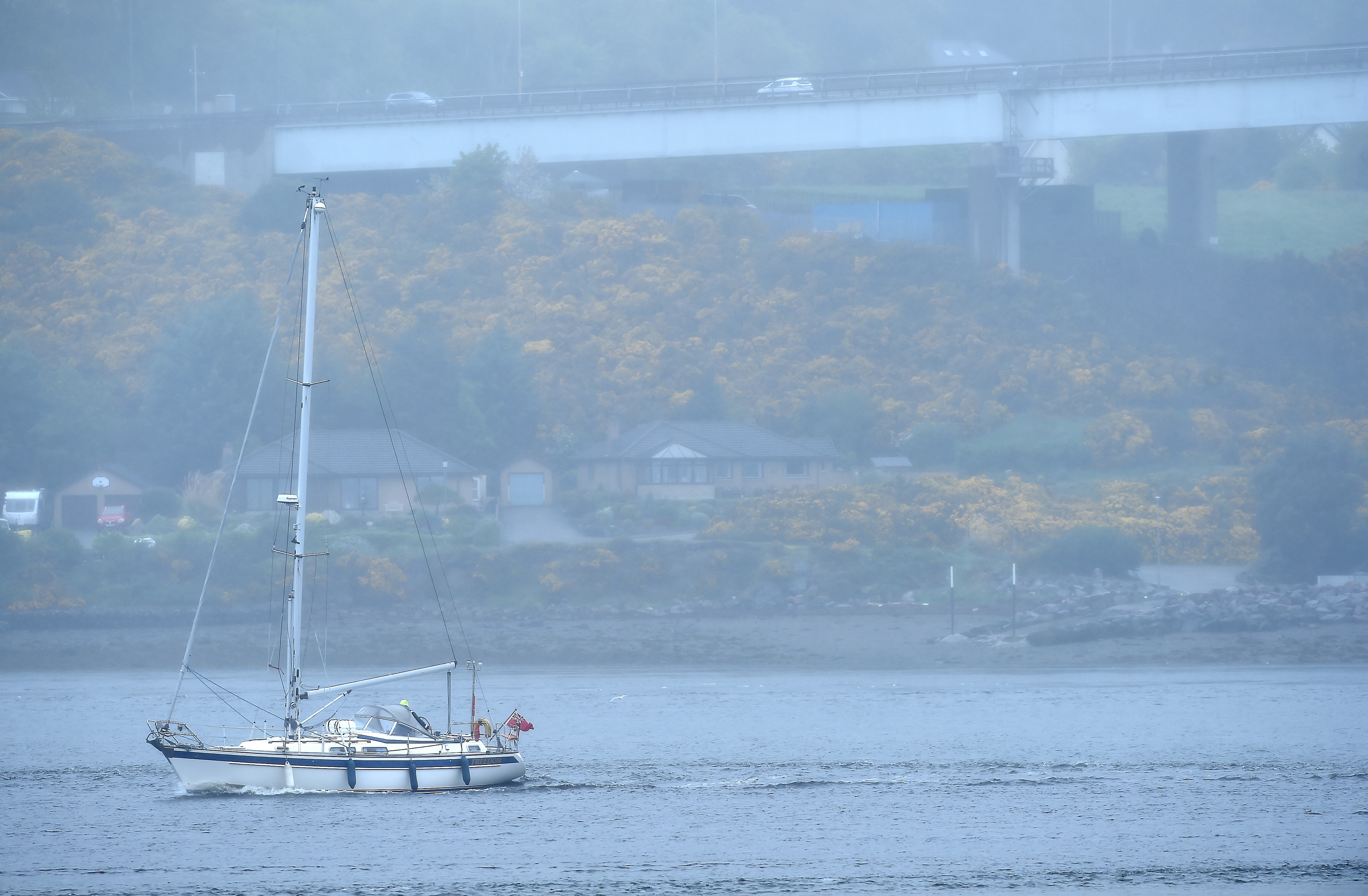 The yacht making its way past the Kessock Bridge.