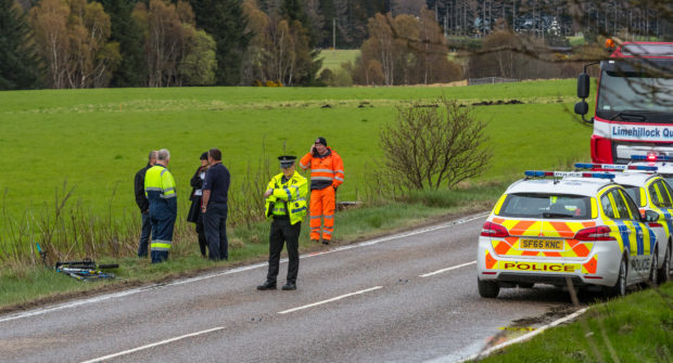 Emergency responders at the scene of the accident near the trout  fishery at Glen of Rothes on the A941 Craigellachie to Elgin road yesterday