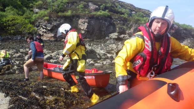 Kyle lifeboat crew assisting the family after they got into difficulty