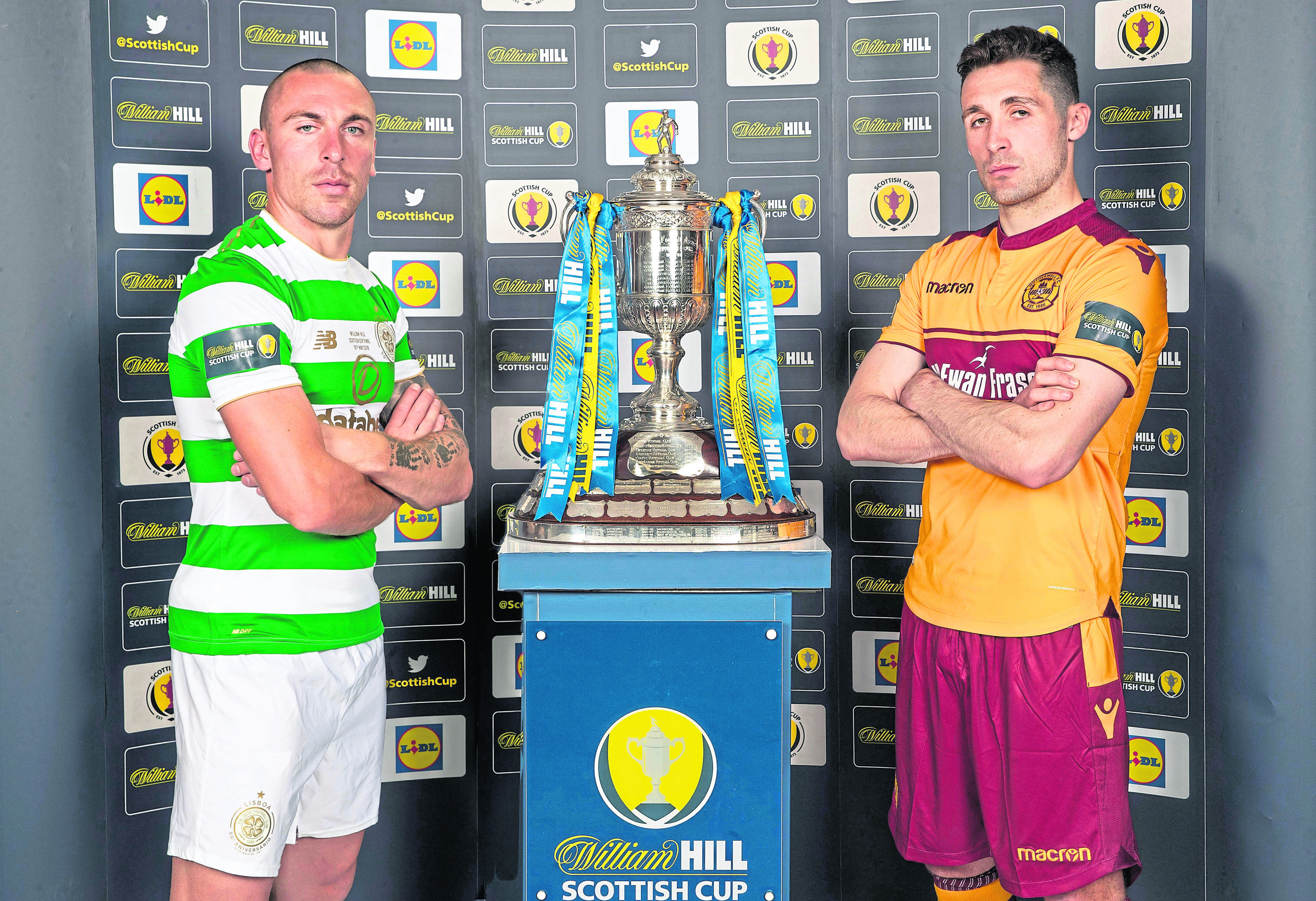 Celtic's Scott Brown and Motherwell's Carl McHugh during the preview day ahead of the Scottish Cup Final at Hampden Park.